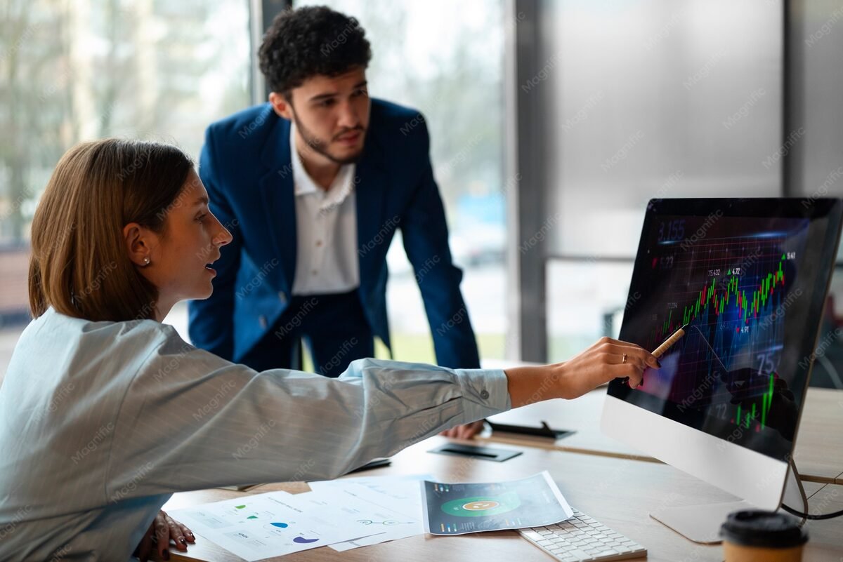 Analysts reviewing finance graphs together